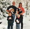 Storey family with dogs in snow
